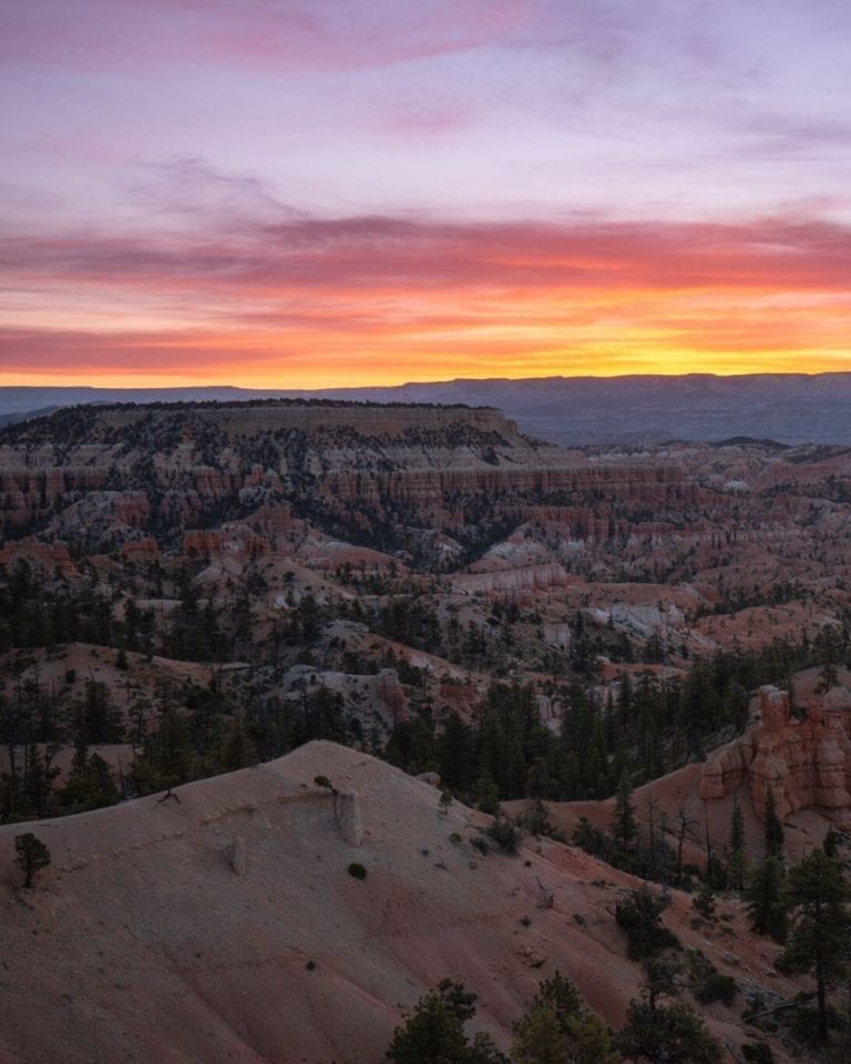 The sun rises over the amphitheater in Bryce Canyon National Park