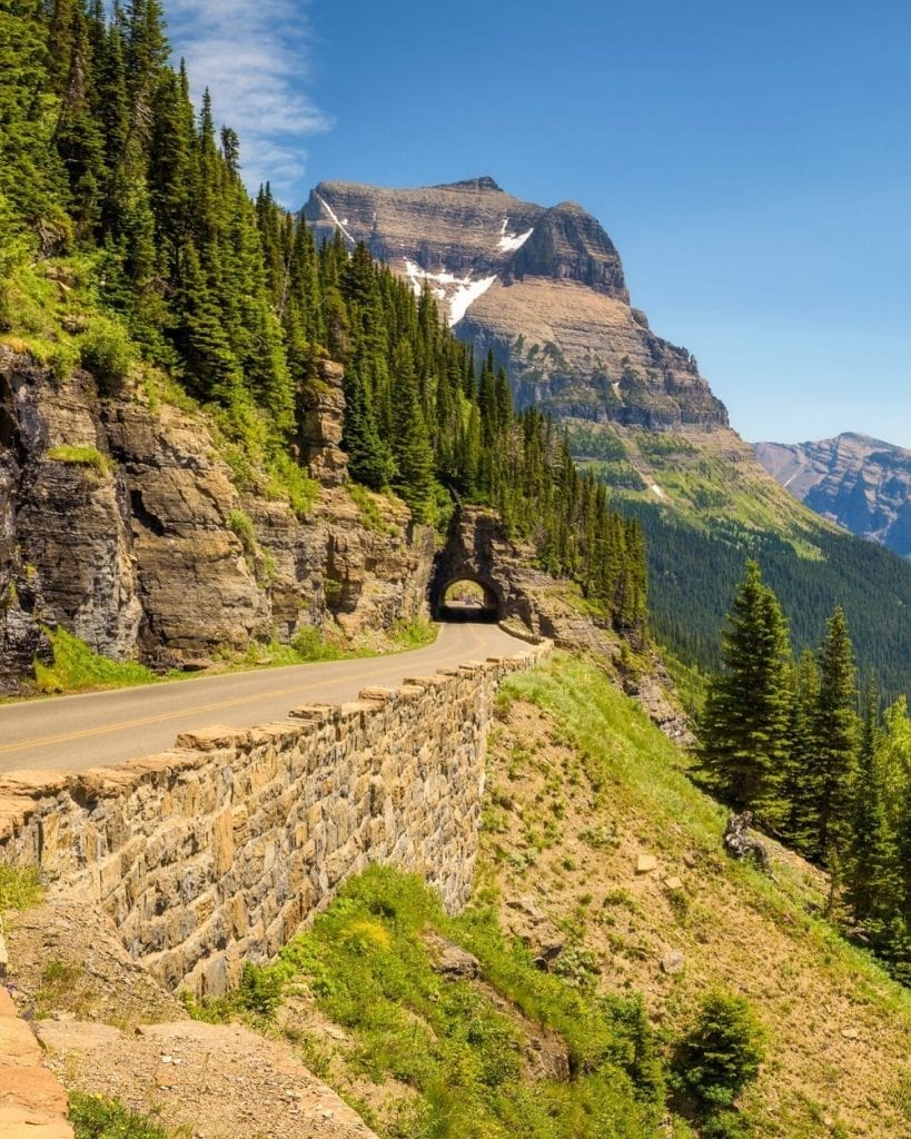 A tunnel in the highway cuts through the mountain on Going-to-the-Sun Road