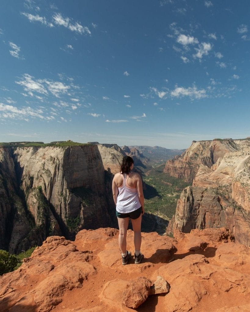 Standing atop Observation Point overlooking the Canyon in Zion National Park