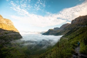 Low hanging fog fills the valley along the Highline Trail in Glacier National Park.