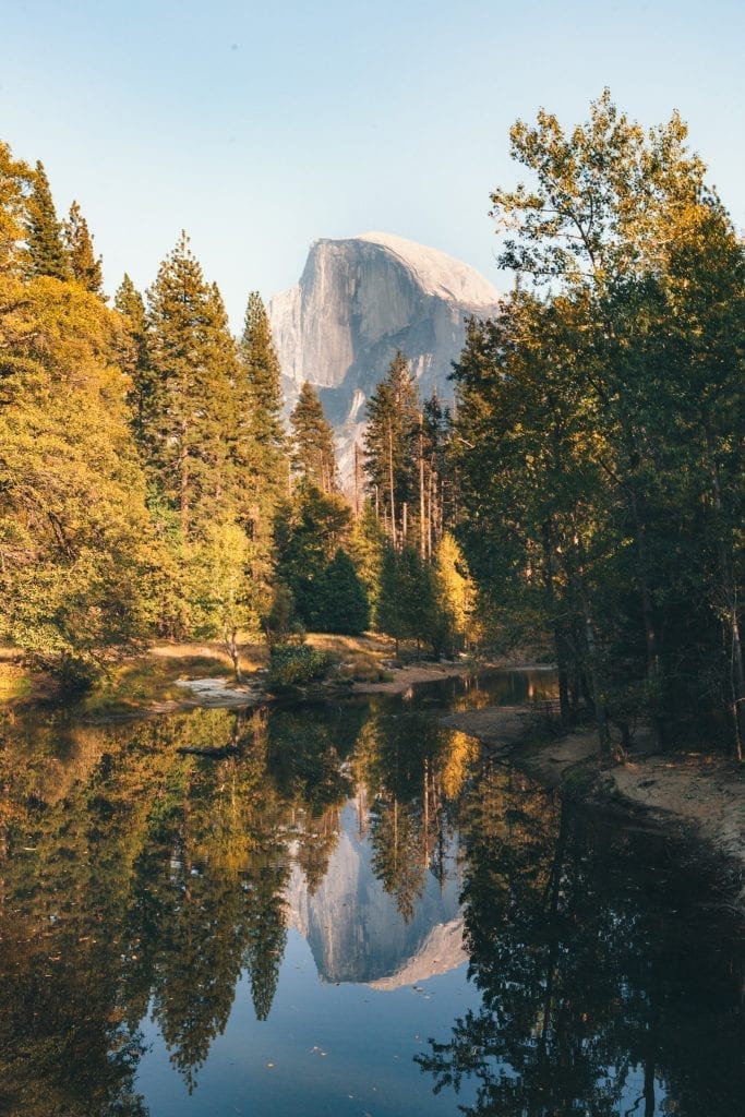 Half Dome is reflected in the Merced River as seen from Sentinel Bridge in Yosemite Valley