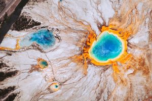 View of Grand Prismatic Spring in Yellowstone National Park from a plane passing overhead