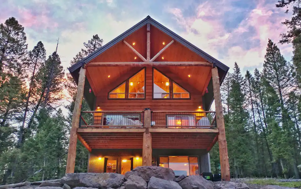 Luxury cabin illuminated at dusk