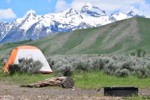 Tent in a campground in front of the Grand Tetons