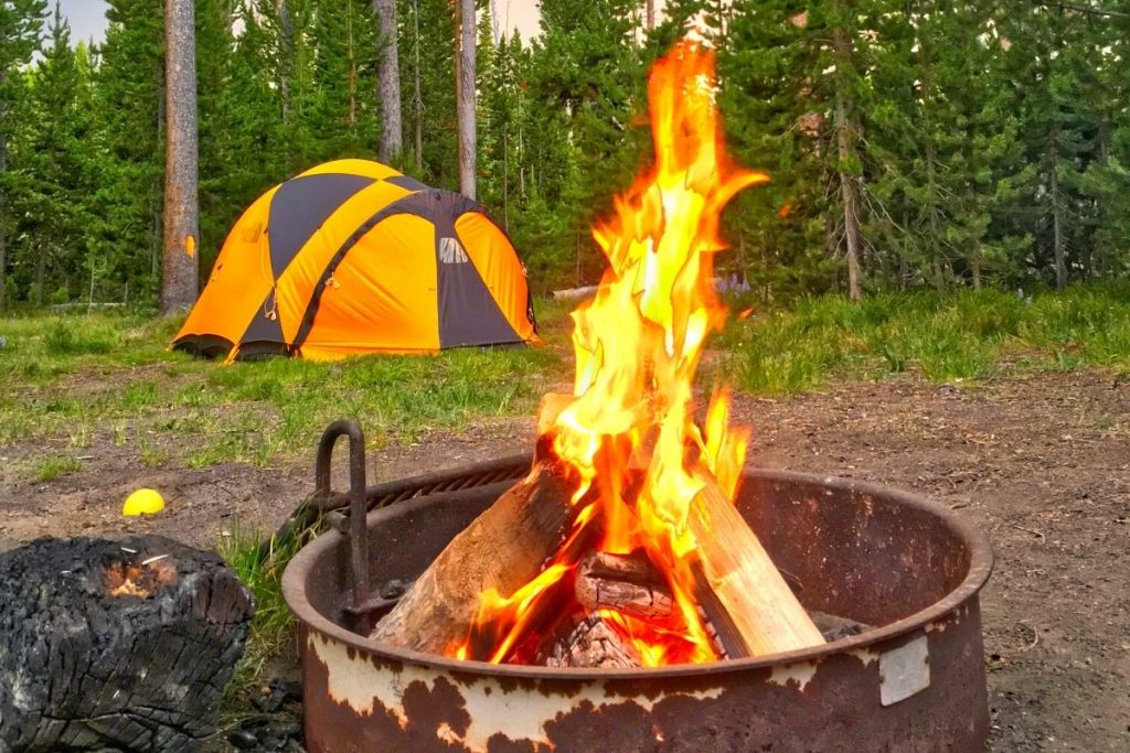 Fire roars at a campsite in Yellowstone National Park