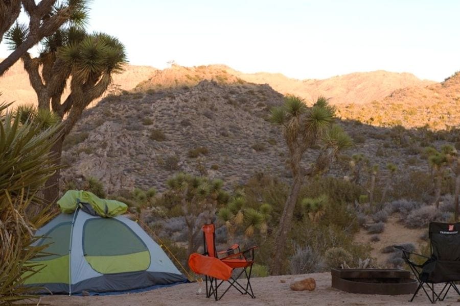 Tent and camp chair at a campsite in Joshua Tree