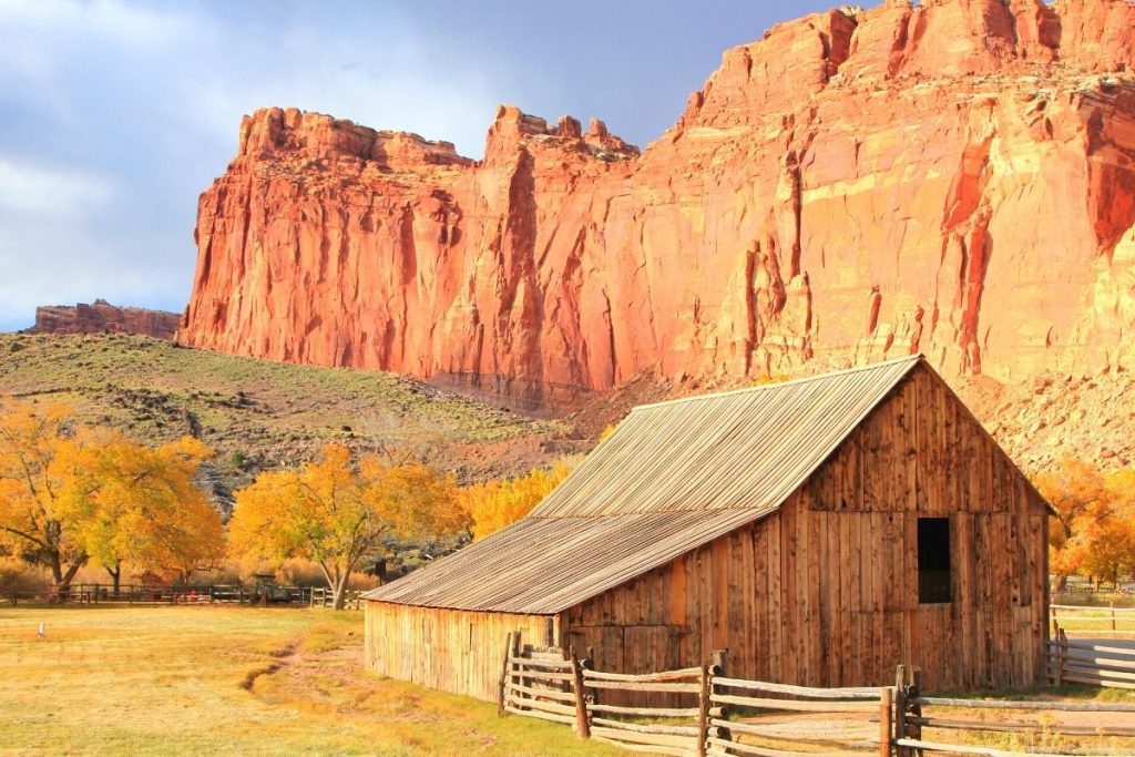 Old barn backed by mountains in Fruita Historic District in Capitol Reef