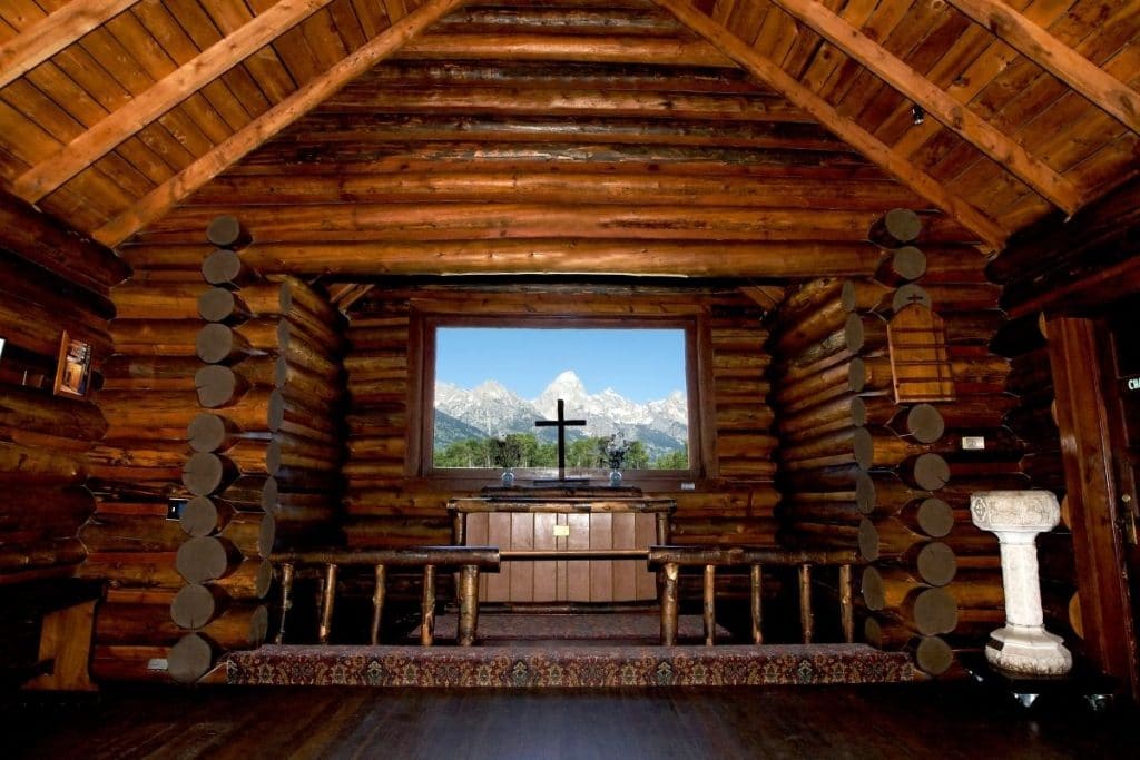 Window at the altar of the Church of the Transfiguration looking at the Teton Range