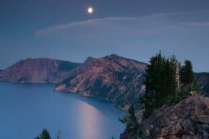 Moon over Crater Lake National Park at night