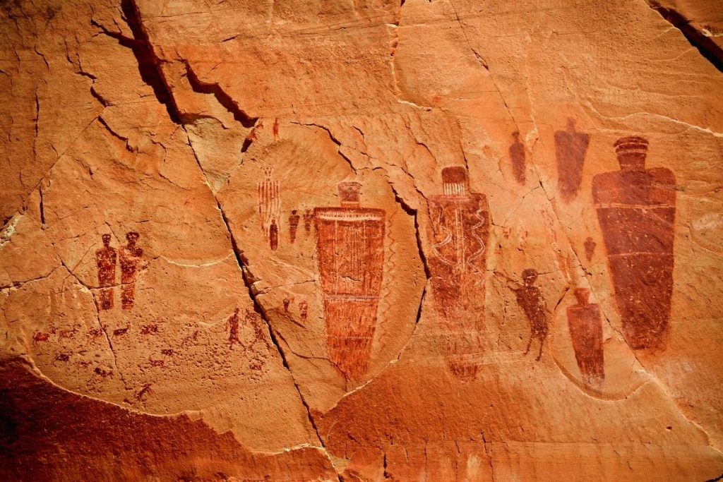 Historic paintings of human-like shapes on a rock wall in the Great Gallery in Canyonlands