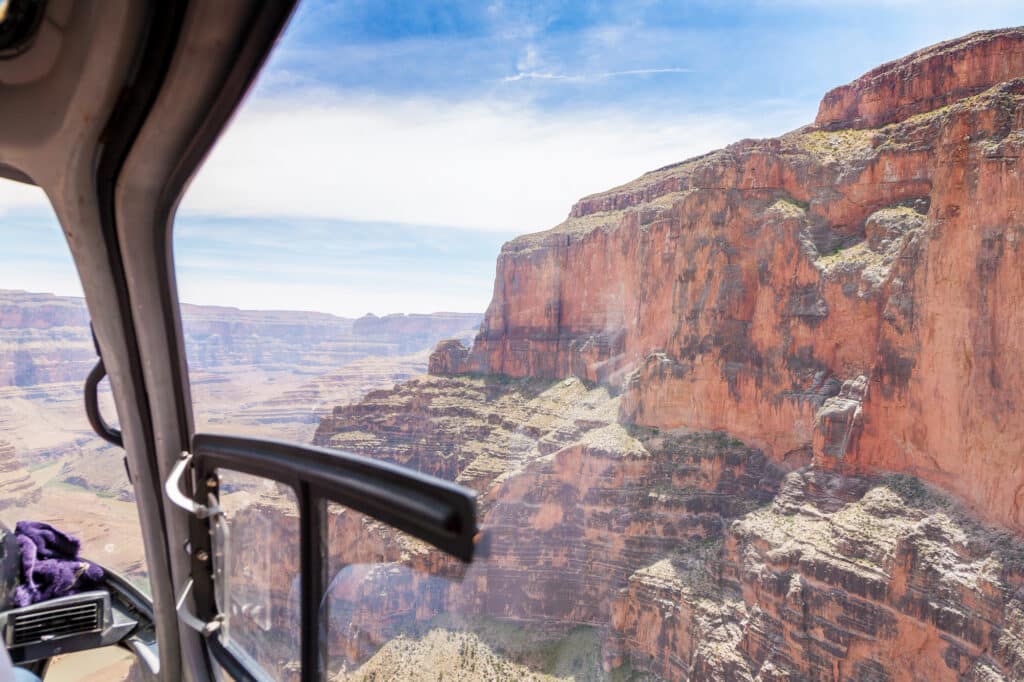 View out of helicopter flying over Grand Canyon