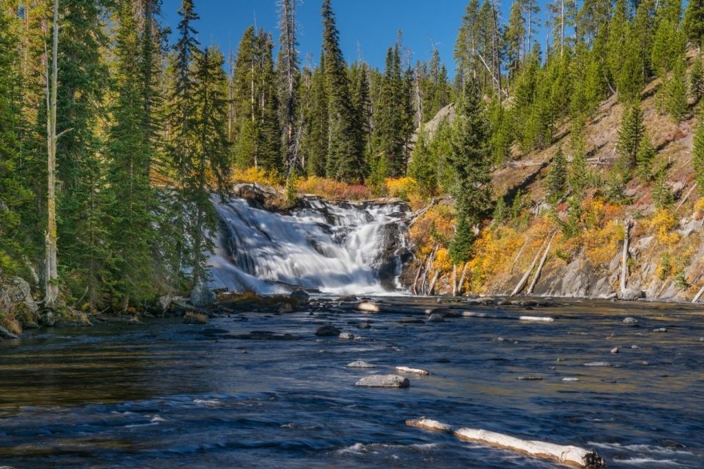 Distant waterfall on the Lewis River between Yellowstone and Grand Teton