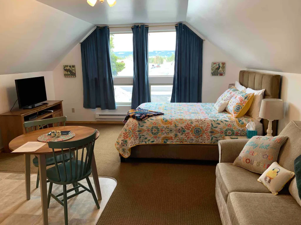 Bedroom of studio apartment in West Yellowstone