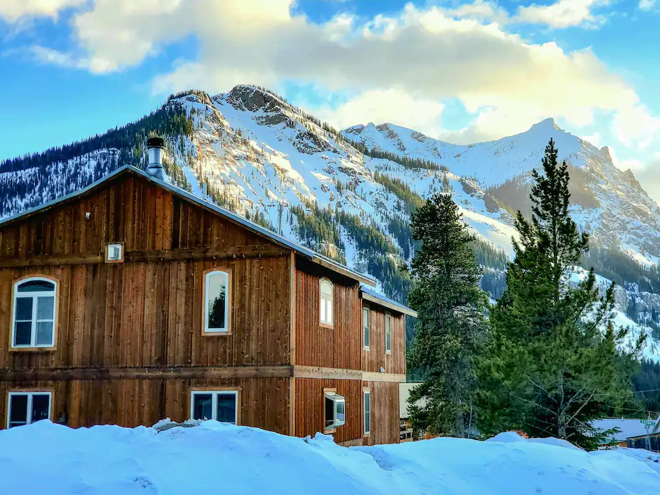 Snow covered mountain lodge at dusk