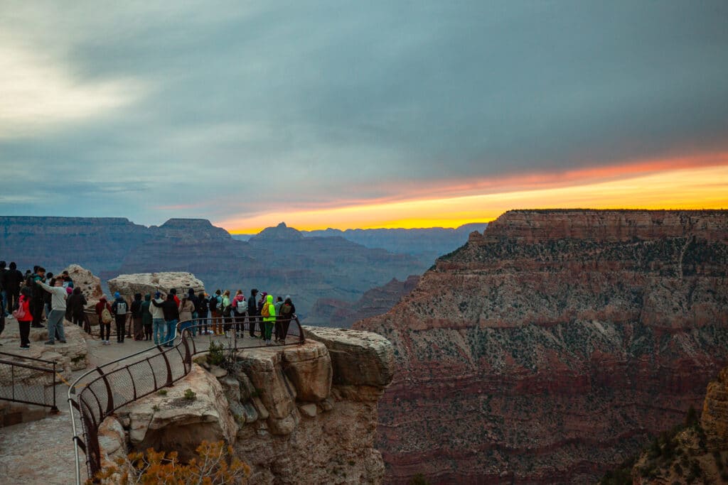 Crowds at Mather Point at sunrise in Grand Canyon National Park South Rim