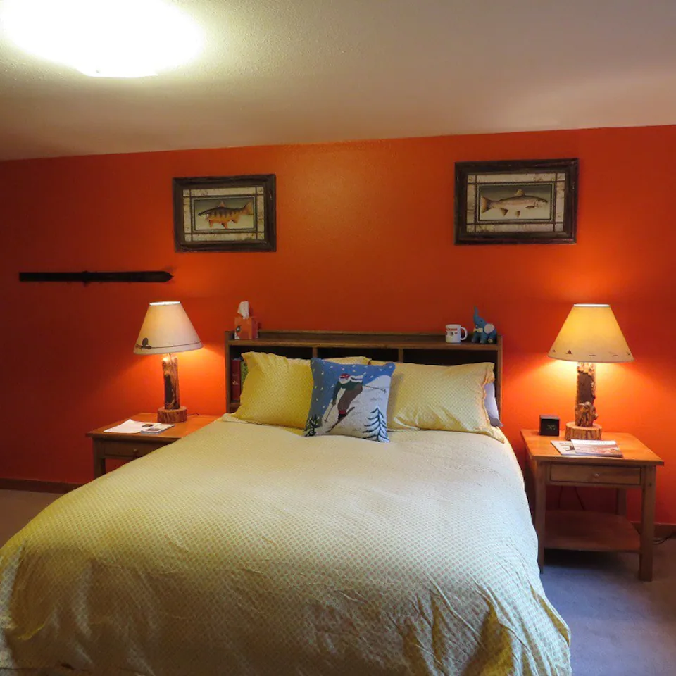 Bedroom with red wall in townhome in Jackson, WY