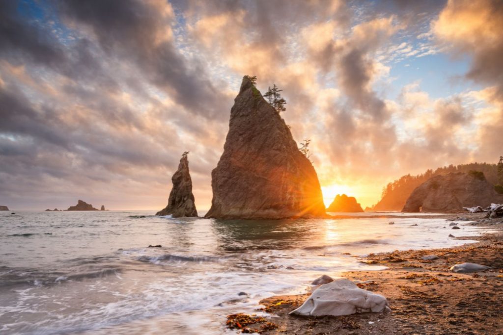 Sunset beyond rock at Rialto Beach in Olympic National Park