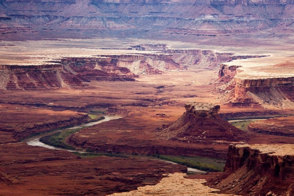 Winding river between rocky canyon in Canyonlands