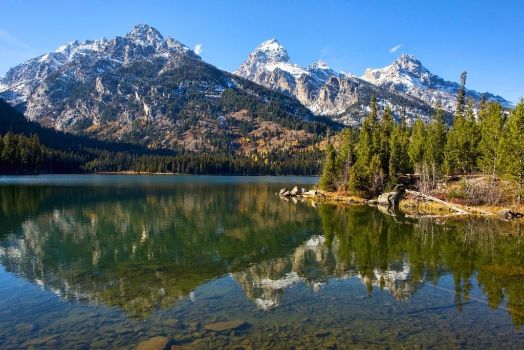 Tetons reflected in Taggart Lake in Grand Teton