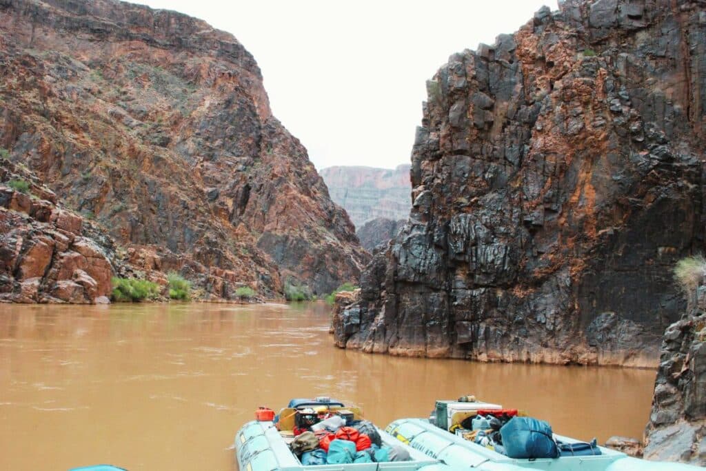 Rafts floating on the Colorado River at the Grand Canyon