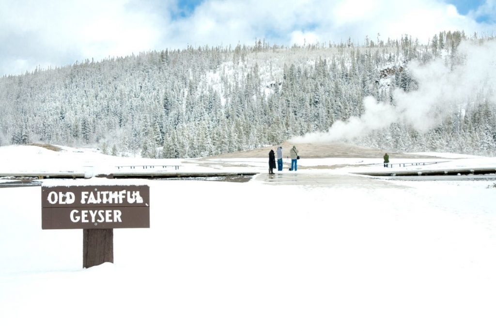 Old Faithful geyser sign in winter