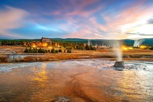 Old Faithful Inn in the background of Yellowstone National Park geothermal features